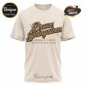 Off-white crew neck t-shirt featuring Bruce Springsteen text logo in gold and black with vintage star accents.!