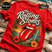 Red cotton t-shirt featuring The Rolling Stones logo, palm trees, hibiscus flowers, and a surfboard at a sunset beach.!