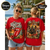 Woman wearing red Rolling Stones t-shirt with tropical sunset graphic, tongue logo, and band members on back at beach.!