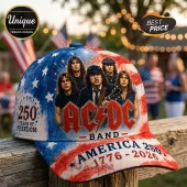 AC/DC band baseball cap featuring American flag print, text 250 Years of Freedom, and America 1776-2026 on a wooden fence.!