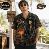 Man wearing short-sleeve button-down shirt with Alice Cooper portrait, skulls, guitars, and tropical beach sunset graphics.!