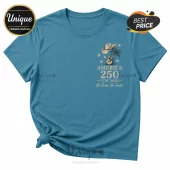 Blue cotton crewneck t-shirt with chest pocket graphic featuring a cowboy hat, guitar, palm tree, and America 250 text.!