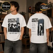 White oversized t-shirt with Arctic Monkeys graphic featuring band members and lyrics on the back in black ink.!