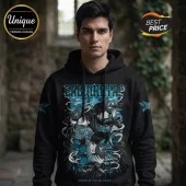 Man wearing black hoodie with blue and white Babymetal World Tour 2026 graphic print featuring three stylized female figures.!