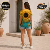 Woman wearing yellow and teal sunflower shirt with text Hold on tight, keep the faith and Livin on a prayer.!