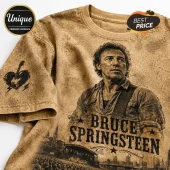 Bruce Springsteen graphic t-shirt with tan acid wash effect, guitar heart sleeve print, and concert crowd imagery.!