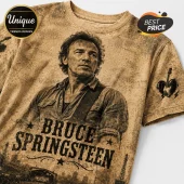 Bruce Springsteen graphic t-shirt in sepia tones with a vintage distressed texture and city skyline silhouette print.!