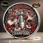 Carolina Hurricanes circular commemorative coin featuring hockey players around a silver Stanley Cup trophy.!