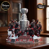Carolina Hurricanes 2026 Stanley Cup champions resin display with players surrounding a silver trophy on a hexagonal base.!