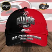 Carolina Hurricanes Stanley Cup 2026 baseball cap in red and black with text 2X Champions 2006-2026 and hockey puck graphic.!