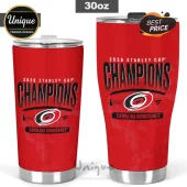 Two red stainless steel 30oz tumblers featuring 2026 Stanley Cup Champions text and Carolina Hurricanes team logo.!