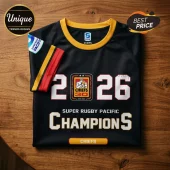 Black and yellow Chiefs Super Rugby Pacific jersey featuring 2026 Champions graphics on a wooden surface.!