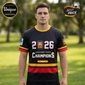 Man wearing a black Chiefs Super Rugby Pacific Champions 2026 t-shirt with red and yellow stripes on a green park background.!
