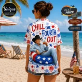 Woman wearing white short-sleeve shirt with Chill The Fourth Out text, cowboy graphic, and red and blue star patterns.!