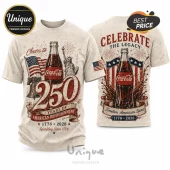 Cream colored t-shirt featuring vintage Coca-Cola bottle, American flag, Statue of Liberty, and 1776-2026 anniversary text.!