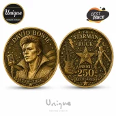 Antique bronze commemorative coin featuring David Bowie, guitar, lightning bolts, and 1776-2026 text on both sides.!