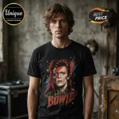 Man wearing a black cotton t-shirt with a graphic of David Bowie featuring a red lightning bolt and the name printed below.!