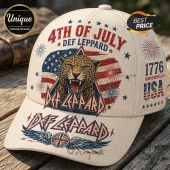 Cream colored baseball cap with Def Leppard 4th of July graphic, leopard face, US flag, fireworks, and 1776 text.!
