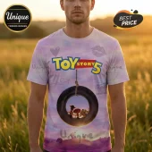 Toy Story 5 graphic t-shirt with pastel tie-dye background, tire swing imagery, and character silhouettes.!