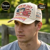 Beige baseball cap with 4th of July Dunkin Donuts branding, American flag graphic, and 1776 text on an outdoor background.!