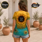 Woman wearing a yellow and teal sunflower t-shirt with text reading Flying high beyond the stars and Rocket Man.!