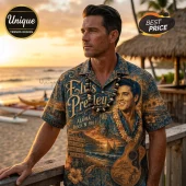 Man wearing navy blue button-up shirt featuring Elvis Presley portrait, guitar, hibiscus flowers, and Hawaiian beach sunset.!