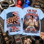 Light blue t-shirts featuring Elvis Presley, American flags, fireworks, and text reading I'm Old But I Saw America Turn 250.!