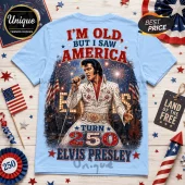 Light blue t-shirt with Elvis Presley graphic, text I'M OLD, BUT I SAW AMERICA, and fireworks background.!