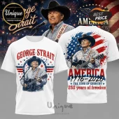 White graphic t-shirt featuring George Strait playing guitar with patriotic red, white, and blue American flag motifs.!