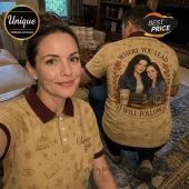 Tan polo shirt with Gilmore Girls pattern, dark maroon collar, and Lorelai and Rory graphic on the back.!