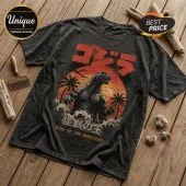Vintage black acid-wash t-shirt featuring a Godzilla illustration, Japanese text, and an orange sunset graphic.!