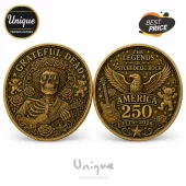 Antique gold commemorative coin featuring Grateful Dead skeleton, dancing bears, an eagle, guitar, and 1776-2026 text.!