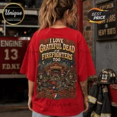 Red graphic t-shirt featuring skeletons playing instruments outside a fire station with a dancing Grateful Dead bear.!
