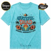Mineral wash blue t-shirt featuring Grateful Dead graphic with sunset, palm trees, hibiscus flowers, and planet icon.!