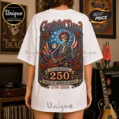 White oversized t-shirt featuring a Grateful Dead graphic with a skeleton playing guitar, red roses, and a US flag motif.!