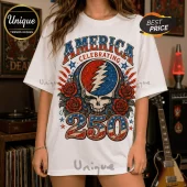 White oversized t-shirt featuring a Grateful Dead style skull logo with red roses, patriotic stars, and 250 in flag colors.!