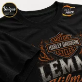 Black cotton t-shirt featuring an orange and silver Harley-Davidson logo graphic with flaming orange fire design.!