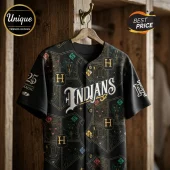 Black baseball jersey featuring Indians text, gold H lettering, and fantasy creature illustrations on a wood background.!
