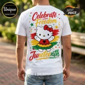 White crewneck t-shirt featuring Hello Kitty in a red, yellow, and green dress with Celebrate Freedom Juneteenth text.!