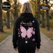 Black hoodie with back print of a large pink butterfly, stars, hearts, and Lucky Me Tour text in a park setting.!