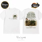 White cotton t-shirt featuring a green John Deere tractor graphic with America 250 text and agricultural farm scenery.!