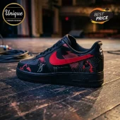 Black Nike Air Force 1 sneaker with red swoosh, Solaris Tour graphics, and white text on a wooden stage floor background.!