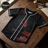 Black Joji baseball jersey featuring Polaris Tour graphic, white piping, and button-down front on a wooden surface.!