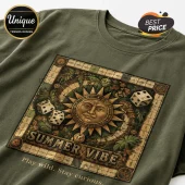 Olive green cotton t-shirt with a vintage board game graphic featuring a sun face, dice, palm leaves, and Summer Vibe text.!