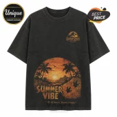 Vintage black mineral wash t-shirt with Jurassic Park chest logo and a sunset graphic featuring palm trees and dino tracks.!