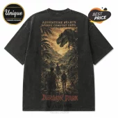 Black acid-wash oversized t-shirt with a vintage Jurassic Park print featuring a T-Rex and explorers in a jungle scene.!