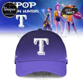 Purple baseball cap with a bold white letter T on the front center panel against a digital anime character background.!