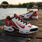 Kappa Alpha Psi sneakers in white and red with 1911 branding, black laces, and emblem detail on a wooden dock by water.!