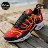 Kappa Alpha Psi athletic sneaker in red, yellow, and black with Greek letters, fraternity crest, and white sole on wood.!