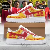 Kappa Alpha Psi custom sneakers in red and yellow leather with fraternity branding on white midsoles and brown shoe box.!
